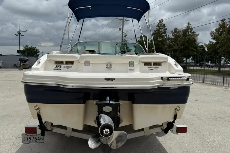 Slide: The Image of 2016 Chaparral 19 H2O Sport boat, rear view with propeller and canopy. - 5