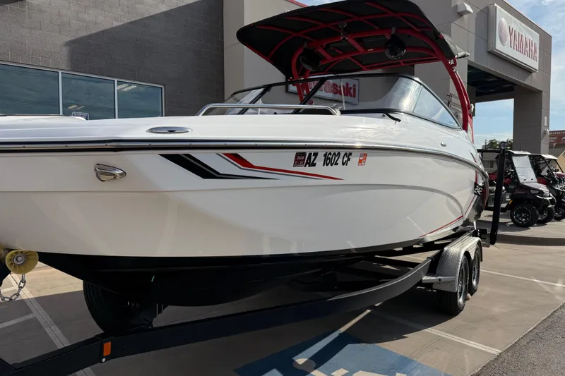 Slide: The Image of 2019 Yamaha Boats 242X E-Series displayed at dealership, featuring sleek design and modern features. - 21