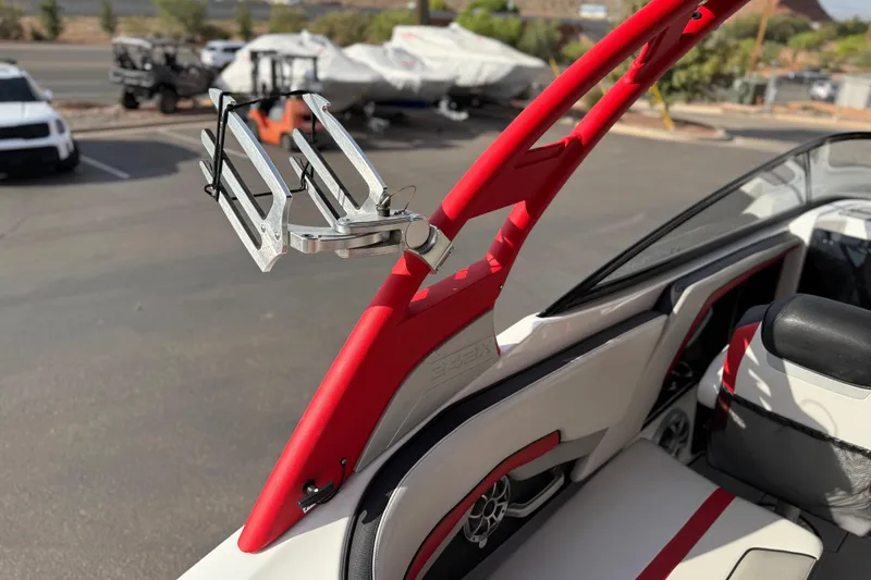 Slide: The Image of 2019 Yamaha Boats 242X E-Series interior with red accents and wakeboard rack. - 35