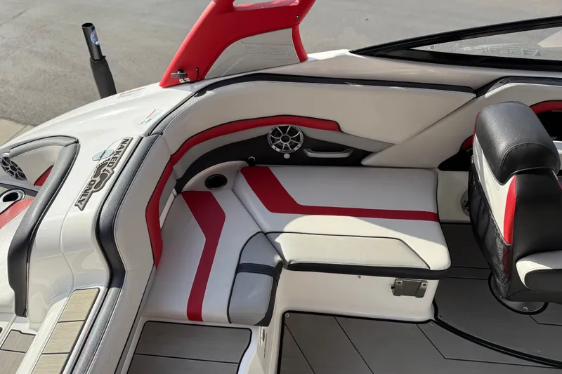 Slide: The Image of 2019 Yamaha Boats 242X E-Series interior with red and white seating, modern design. - 37