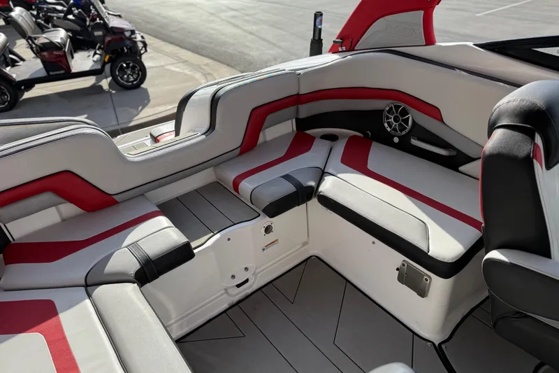 Slide: The Image of 2019 Yamaha Boats 242X E-Series interior with red and black seating accents. - 38