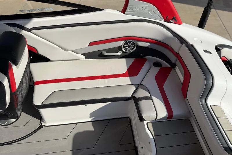 Slide: The Image of 2019 Yamaha Boats 242X E-Series interior with red and white seating, modern design. - 40