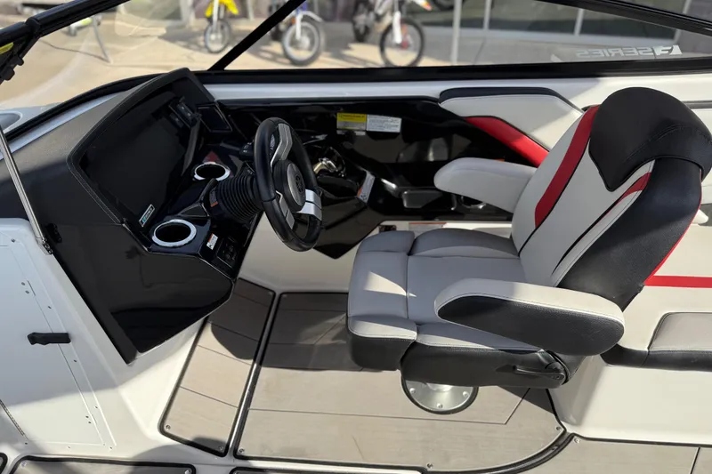 Slide: The Image of 2019 Yamaha Boats 242X E-Series cockpit with modern steering and comfortable seating. - 43