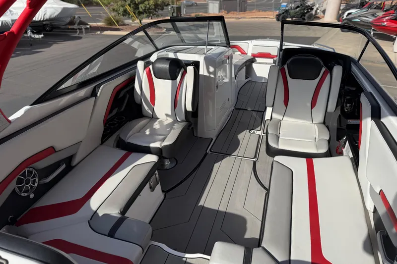 Slide: The Image of 2019 Yamaha Boats 242X E-Series interior with red and white seating, sleek design. - 46