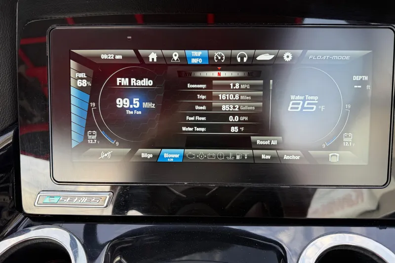 Slide: The Image of 2019 Yamaha Boats 242X E-Series dashboard displaying FM radio, fuel, and water temperature. - 47