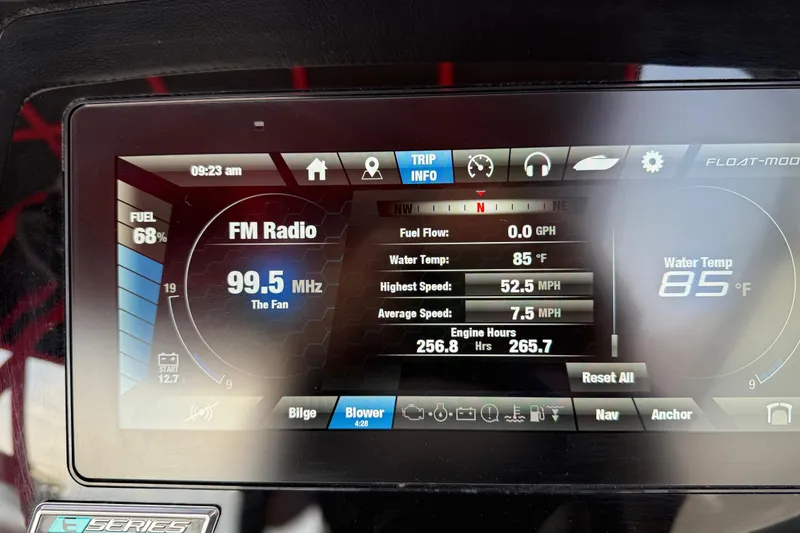 Slide: The Image of Dashboard of a 2019 Yamaha Boats 242X E-Series showing fuel, speed, and radio settings. - 52