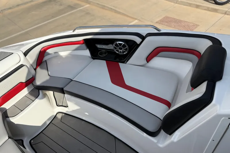 Slide: The Image of 2019 Yamaha Boats 242X E-Series interior with red and black accents, featuring comfortable seating. - 59
