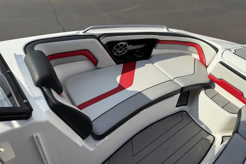 Slide: The Image of 2019 Yamaha Boats 242X E-Series interior with red and gray seating, sleek design. - 60