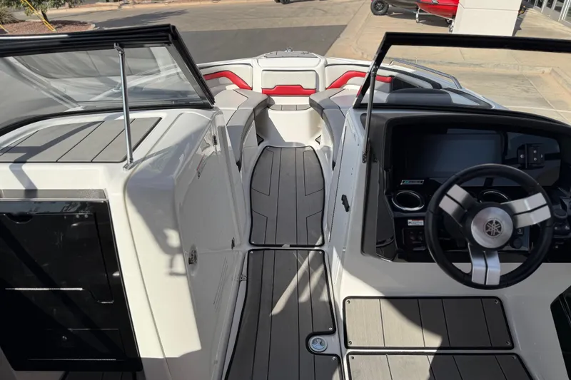 Slide: The Image of 2019 Yamaha Boats 242X E-Series interior with sleek dashboard and modern steering wheel. - 61