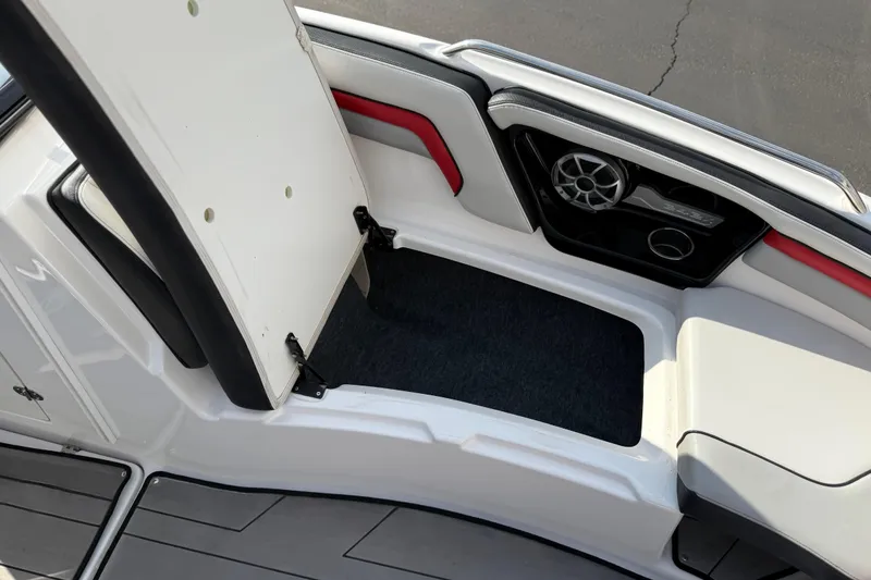 Slide: The Image of 2019 Yamaha Boats 242X E-Series interior with speaker and seating area. - 64