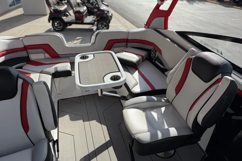 Slide: The Image of 2019 Yamaha Boats 242X E-Series interior with stylish seating and table setup. - 69