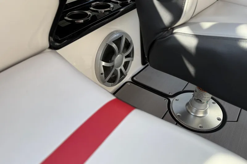 Slide: The Image of 2019 Yamaha Boats 242X E-Series interior with speaker and seating detail. - 73