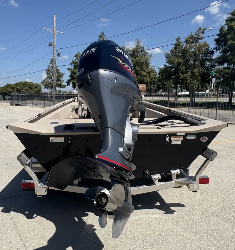 Slide: The Image of 2023 Avid 18 Rogue CC boat interior with steering console and seating. - 3