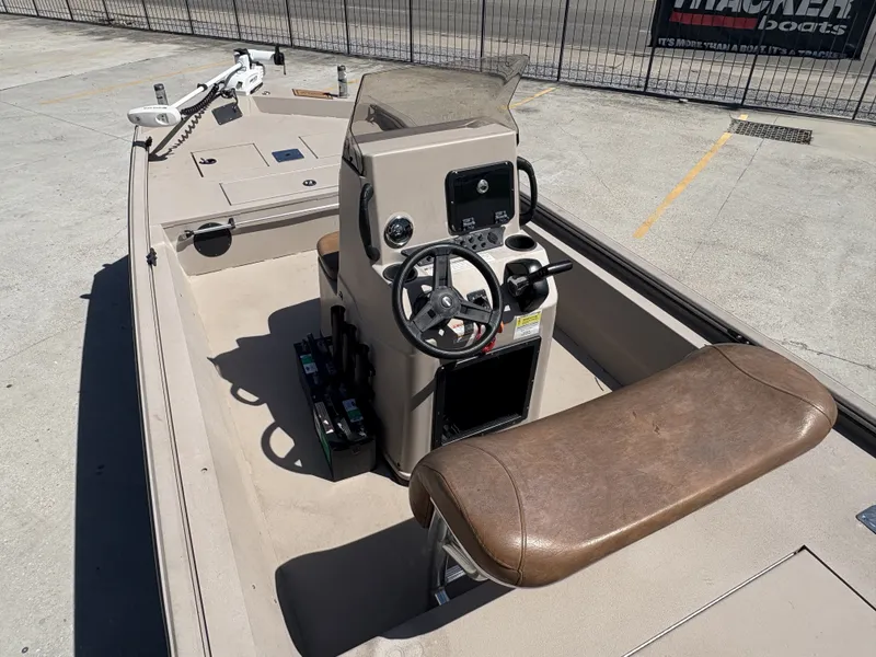 Slide: The Image of 2023 Avid 18 Rogue CC boat with Yamaha outboard motor on trailer, parked outdoors. - 8