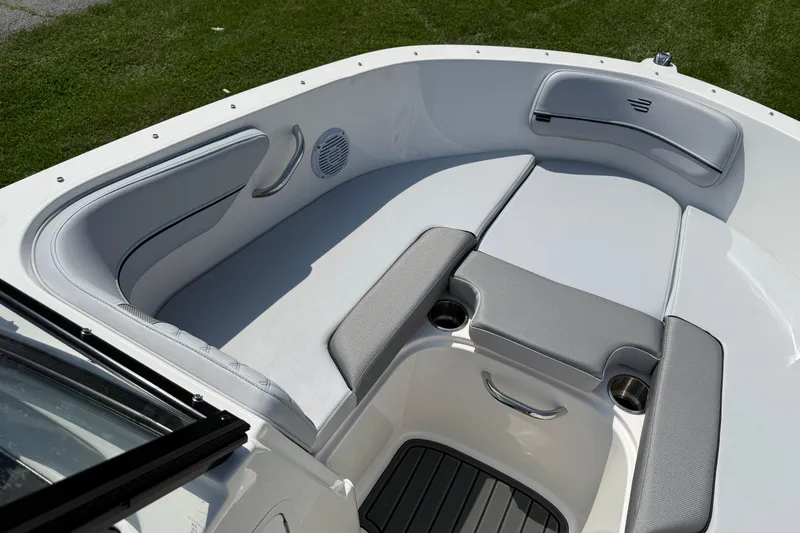 Slide: The Image of 2025 Bayliner VR4 Bowrider I/O boat interior with cushioned seating and cup holders. - 13