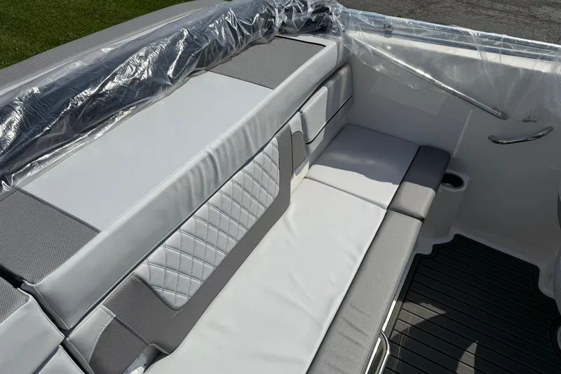 Slide: The Image of 2025 Bayliner VR4 Bowrider I/O interior with cushioned seating and sleek design. - 8