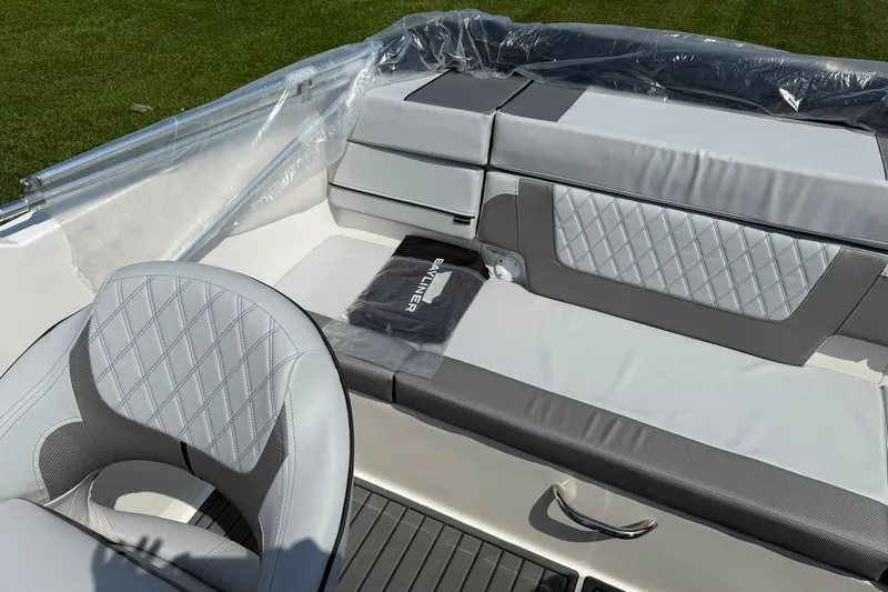 Slide: The Image of 2025 Bayliner VR4 Bowrider I/O interior with diamond-stitched seating and sleek design. - 9