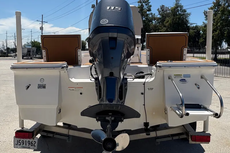 Slide: The Image of 2014 Seafox 180 Viper boat with outboard motor on trailer, rear view. - 5
