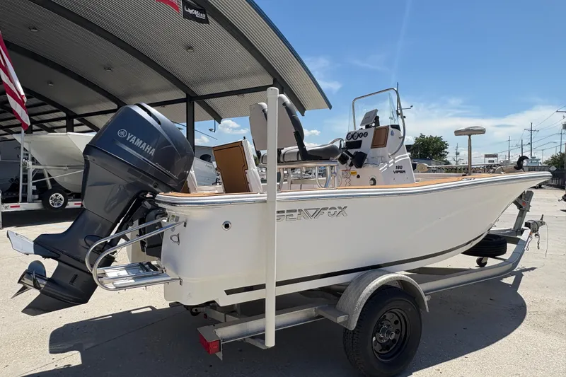 Slide: The Image of 2014 Seafox 180 Viper boat with Yamaha engine on trailer, parked outdoors. - 6