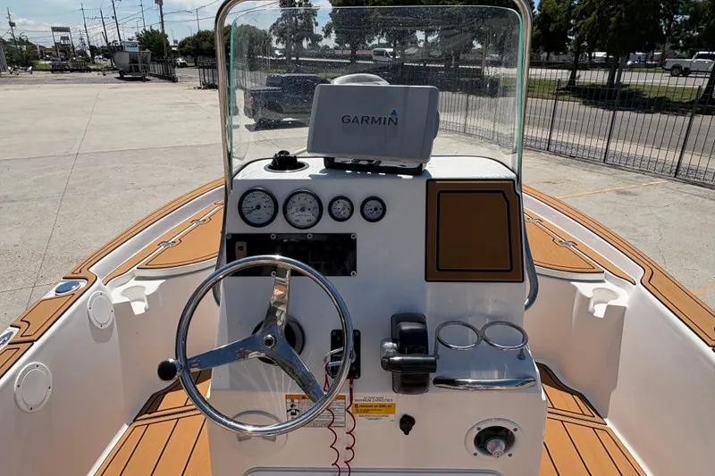 Slide: The Image of 2014 Seafox 180 Viper boat dashboard with Garmin navigation system and steering wheel. - 8