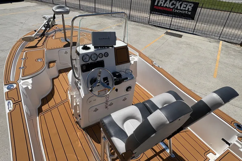 Slide: The Image of 2014 Seafox 180 Viper boat interior with wood finish and modern controls. - 9