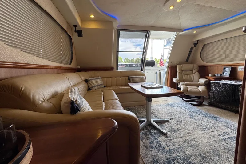 Slide: The Image of Luxurious interior of a 2003 Silverton 410 Sport Bridge yacht with leather seating and elegant decor. - 16