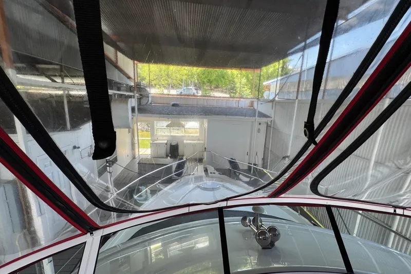 Slide: The Image of 2003 Silverton 410 Sport Bridge yacht in a covered dock, viewed from the helm. - 21