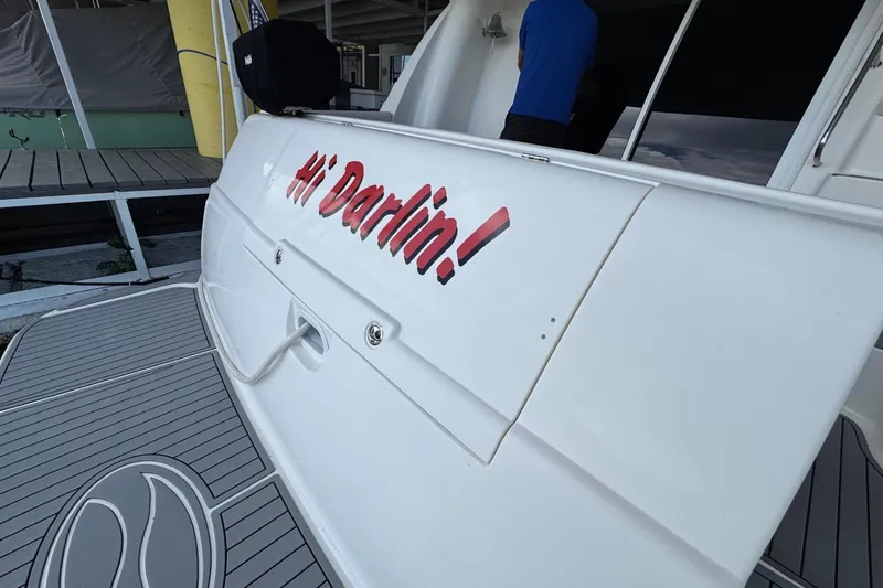Slide: The Image of 2003 Silverton 410 Sport Bridge with "Hi Darlin!" text on the stern. - 27