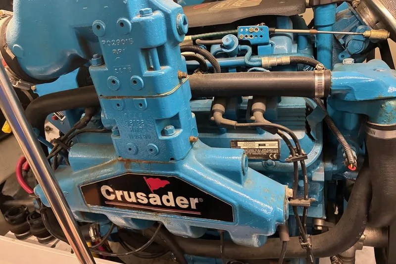 Slide: The Image of Engine of a 2003 Silverton 410 Sport Bridge with Crusader branding. - 30