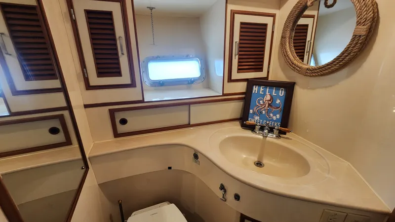 Slide: The Image of Bathroom interior of 1987 Hi-Star 48 Sundeck yacht with nautical decor. - 14