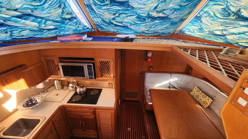 Slide: The Image of Interior of 1987 Hi-Star 48 Sundeck yacht with kitchen and dining area. - 23