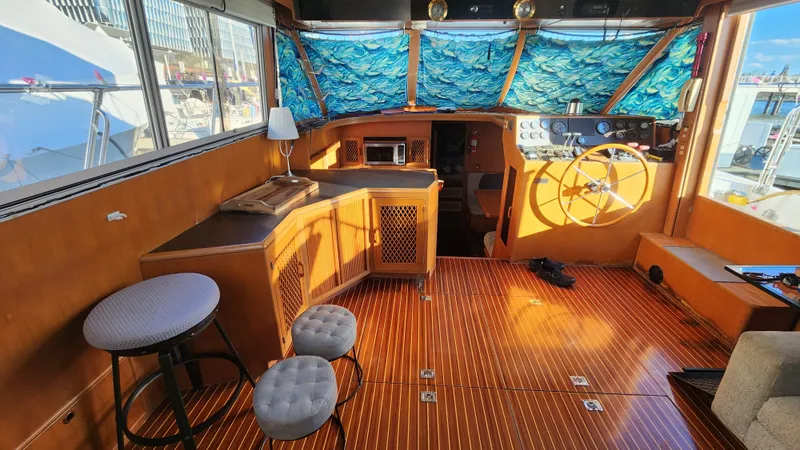 Slide: The Image of Interior of 1987 Hi-Star 48 Sundeck yacht with wooden flooring and nautical decor. - 30