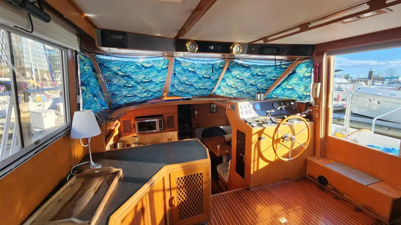 Slide: The Image of 1987 Hi-Star 48 Sundeck interior with nautical decor and helm station. - 35