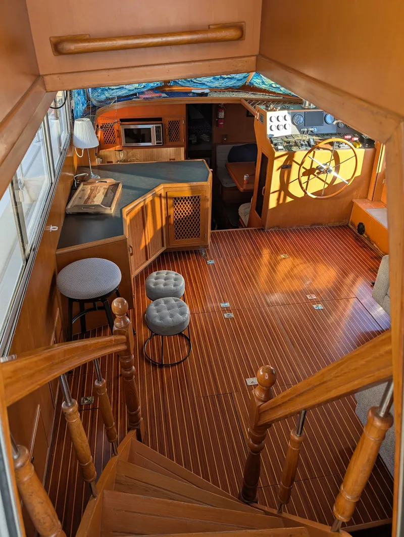 Slide: The Image of Interior of 1987 Hi-Star 48 Sundeck yacht with wooden flooring and helm station. - 7