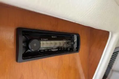 Slide: The Image of 2003 Regal Commodore 2860 interior with Sony stereo system on wooden panel. - 13