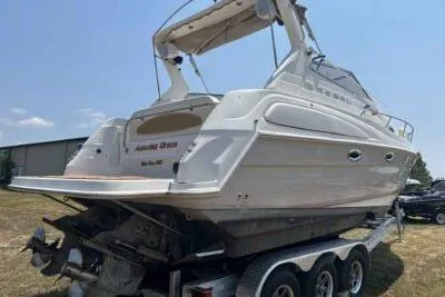 Slide: The Image of 2003 Regal Commodore 2860 boat on trailer, rear view, sunny day. - 4