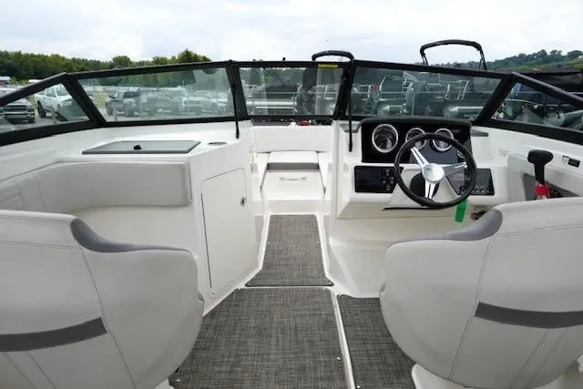 Slide: The Image of 2020 Sea Ray SPX 190 boat interior with steering wheel and seating. - 12