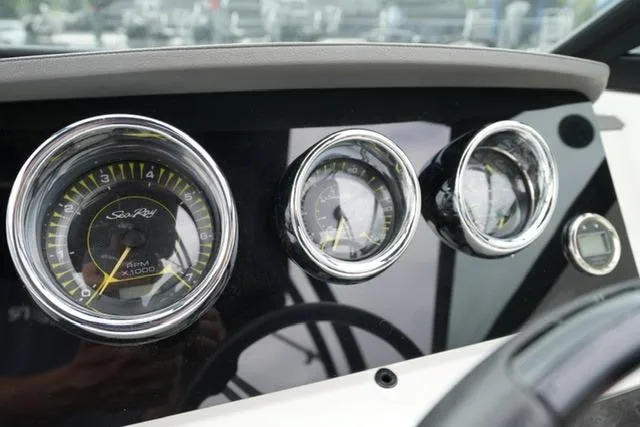 Slide: The Image of Dashboard of 2020 Sea Ray SPX 190 boat with gauges and controls. - 15