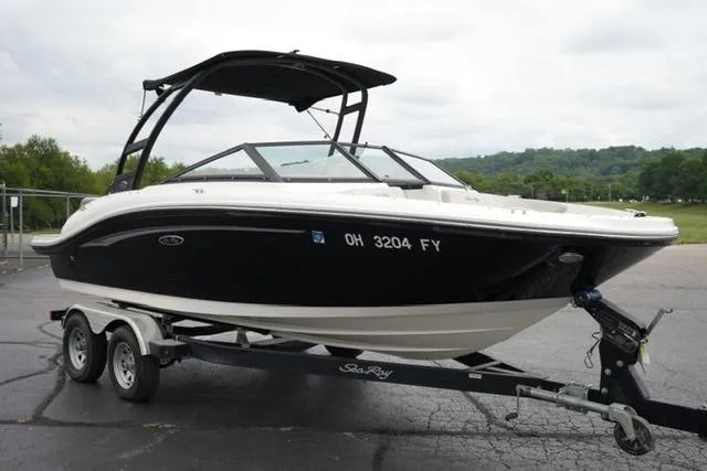 Slide: The Image of 2020 Sea Ray SPX 190 boat on trailer, black and white design, parked outdoors. - 3