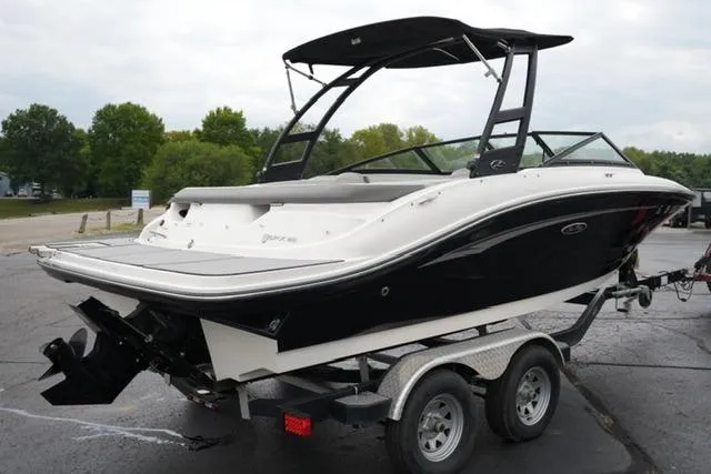 Slide: The Image of 2020 Sea Ray SPX 190 boat on trailer, black and white design, parked outdoors. - 5