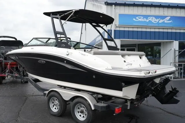 Slide: The Image of 2020 Sea Ray SPX 190 boat on trailer, parked outside dealership. - 7