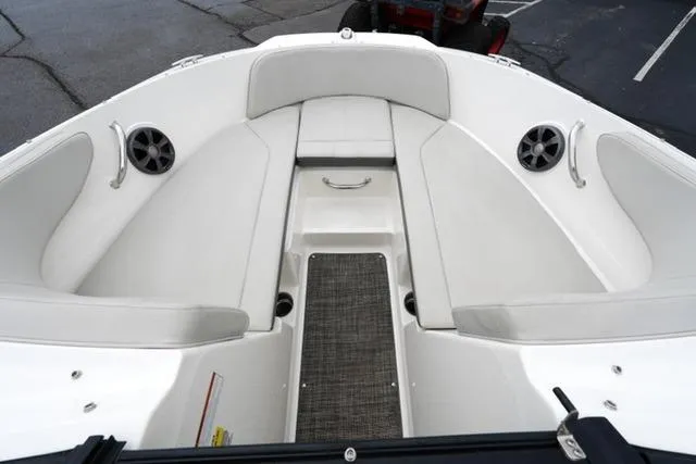 Slide: The Image of 2020 Sea Ray SPX 190 boat interior with white seating and speakers. - 9