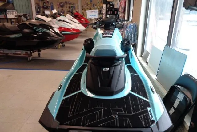 Slide: The Image of 2025 Yamaha WaveRunner VX Limited Ho in showroom, turquoise color, rear view. - 8