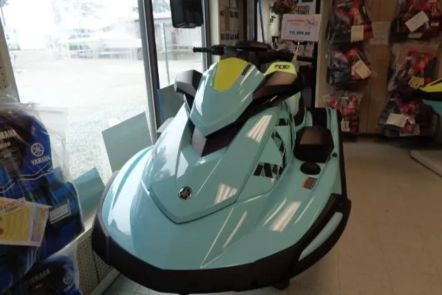 Slide: The Image of 2025 Yamaha WaveRunner VX Limited Ho in showroom, sleek design, light blue color. - 9