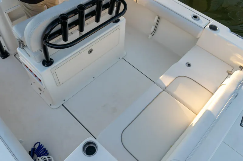 Slide: The Image of 2021 Sea Born LX24 Center Console boat interior with seating and rod holders. - 10