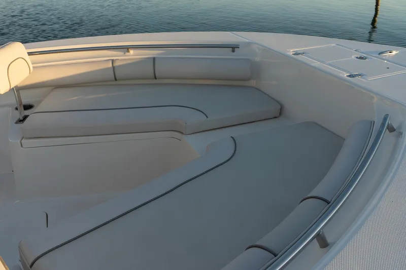 Slide: The Image of 2021 Sea Born LX24 Center Console boat interior with cushioned seating. - 13