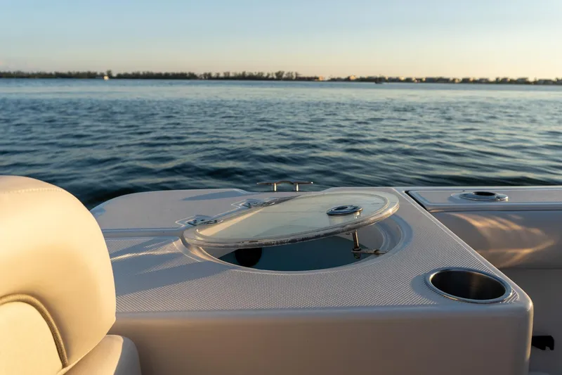 Slide: The Image of 2021 Sea Born LX24 Center Console boat interior with ocean view at sunset. - 16