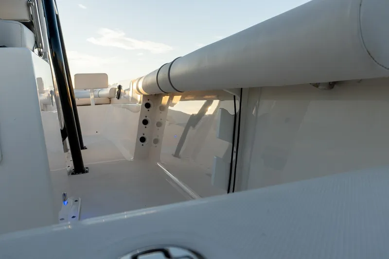 Slide: The Image of 2021 Sea Born LX24 Center Console boat interior with seating and rod holders. - 17