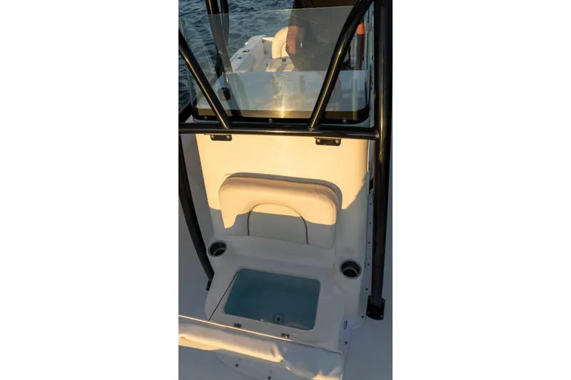 Slide: The Image of 2021 Sea Born LX24 Center Console interior with seating and storage compartment. - 24