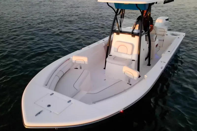 Slide: The Image of 2021 Sea Born LX24 Center Console boat on calm water at sunset. - 28